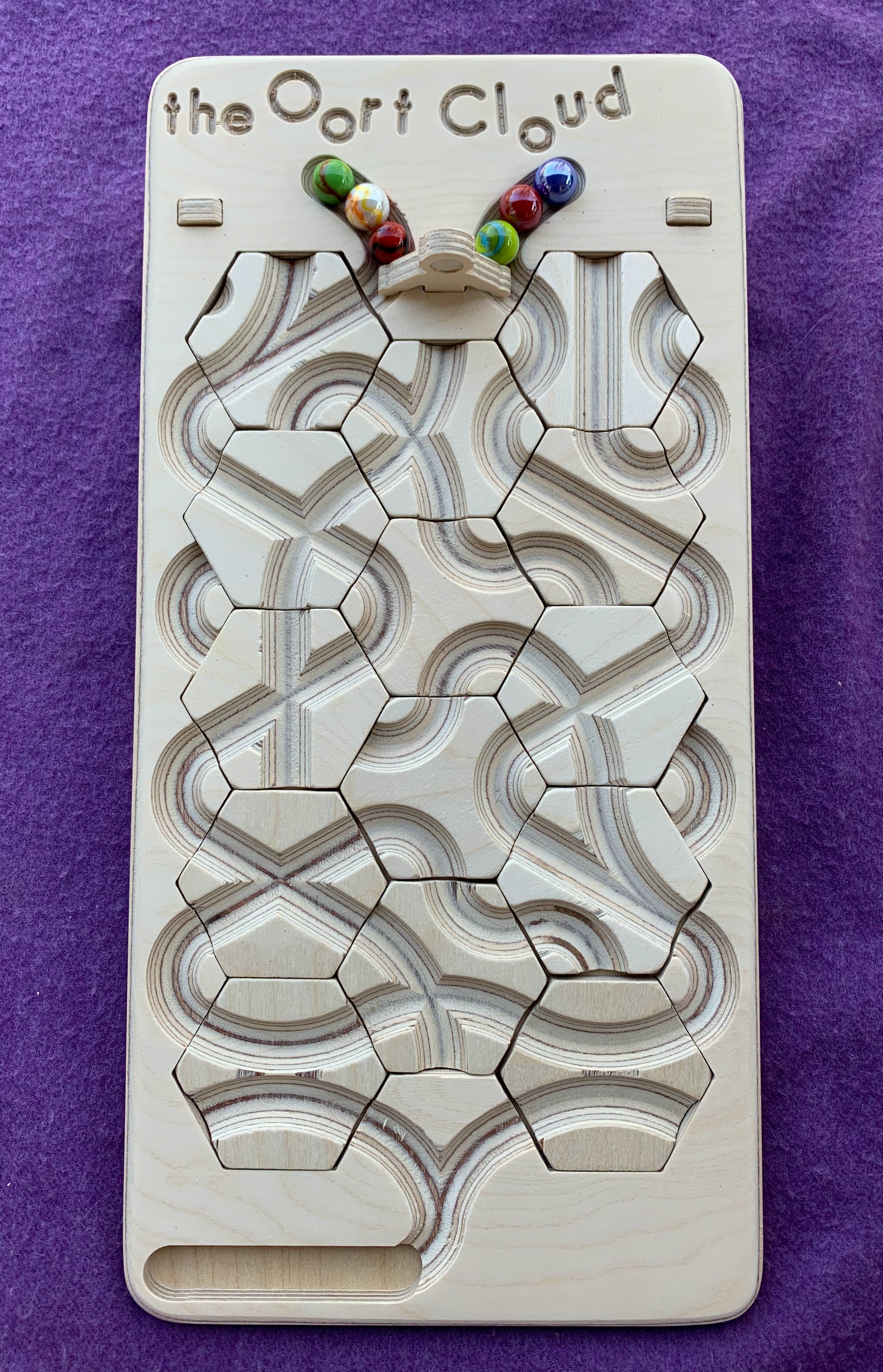 The Oort Cloud: A Marble Run Puzzle Game
